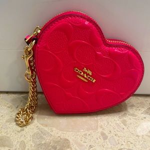 Coach heart shaped wristlet purse.